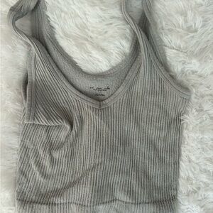 Out from under light blue tank top